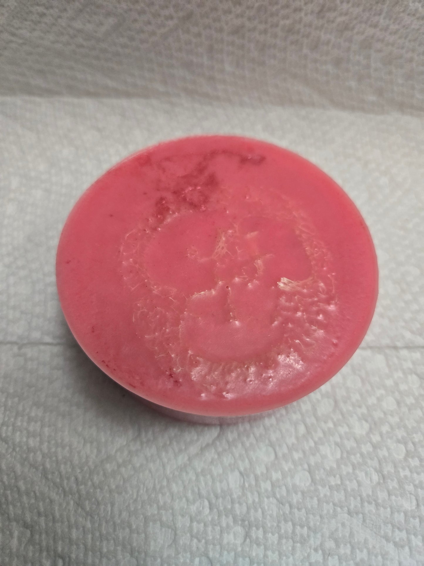 Zaya Soaps Red Cherry Slushie loofah soap Top view of a round red handmade soap with a natural loofah embedded in the center by Zaya Soaps LLC