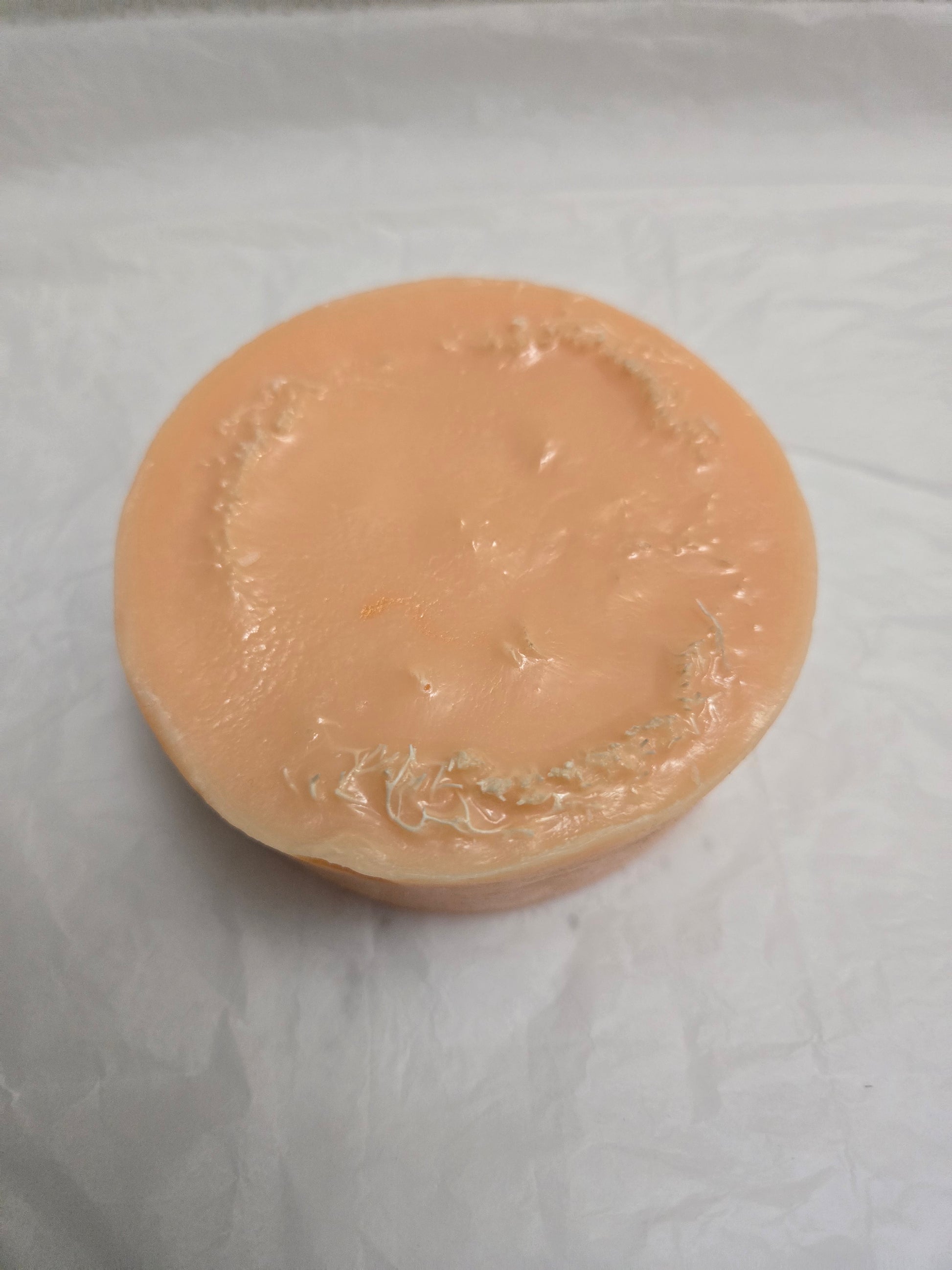 Zaya Soaps Peach Loofah Soap Top view of round peach colored handmade soap- By Zaya Soaps LLC
