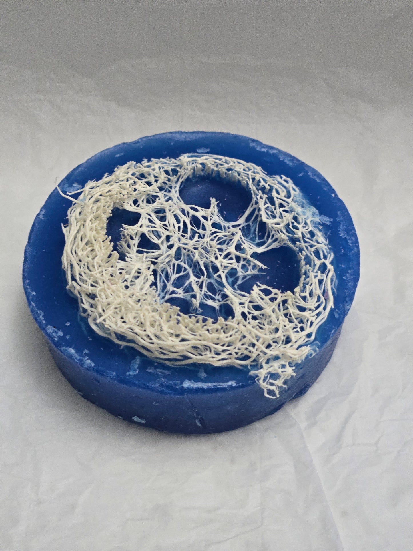 Zaya Soaps Blue Loofah Soap Top view of round Blue handmade soap with natural loofah texture embedded in the center- By Zaya Soaps LLC