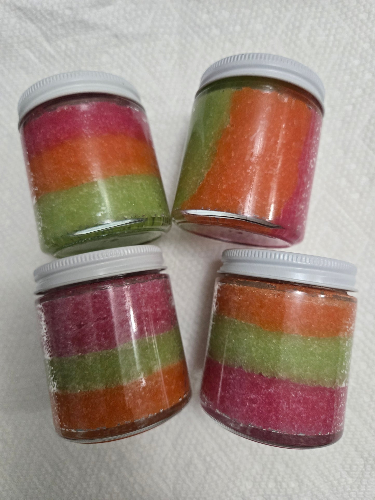 Zaya Soaps Rainbow Burst Sugar Scrub 4oz. Four jars showing Orange, Green, Rose Gold- by Zaya Soaps LLC